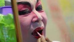 Sai Film actor applying lipstick